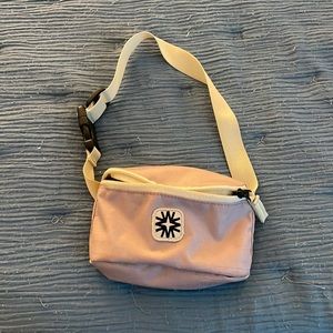 To fanny packs one pink one green. NOT A SET!